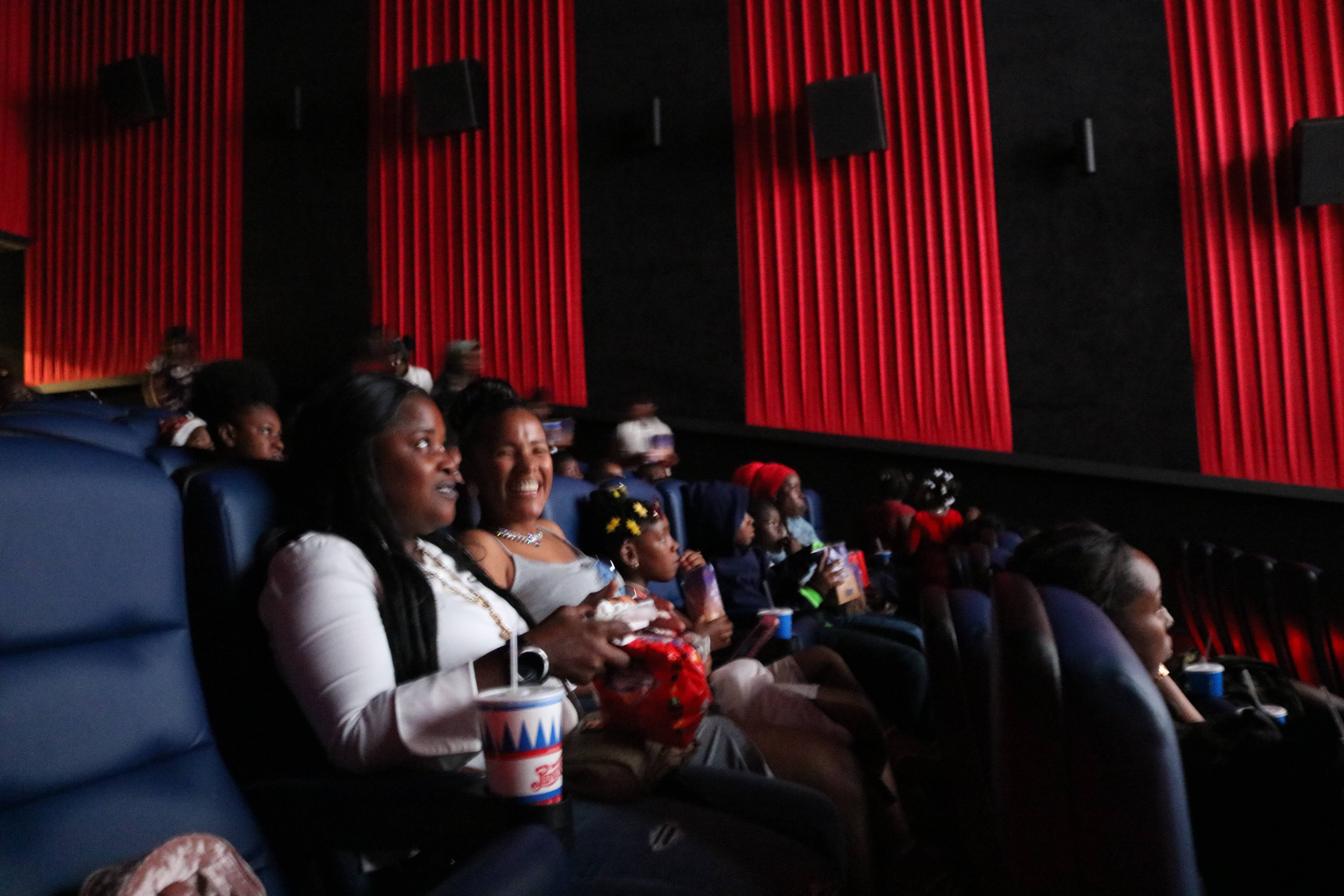 Readers and parents watch Spiderman into the Spiderverse.jpg